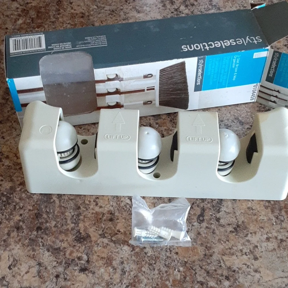 Broom and mop organizer